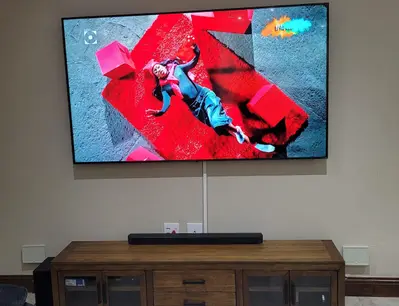 Wall mounted TV with soundbar in modern living room